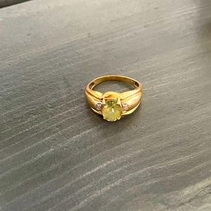 10 k gold ring with green gemstone. Size 6.5
